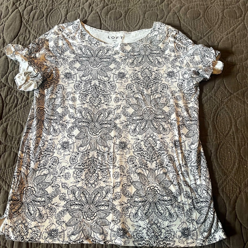 Soft feminine top. Frilly sleeve. Dress up or down.